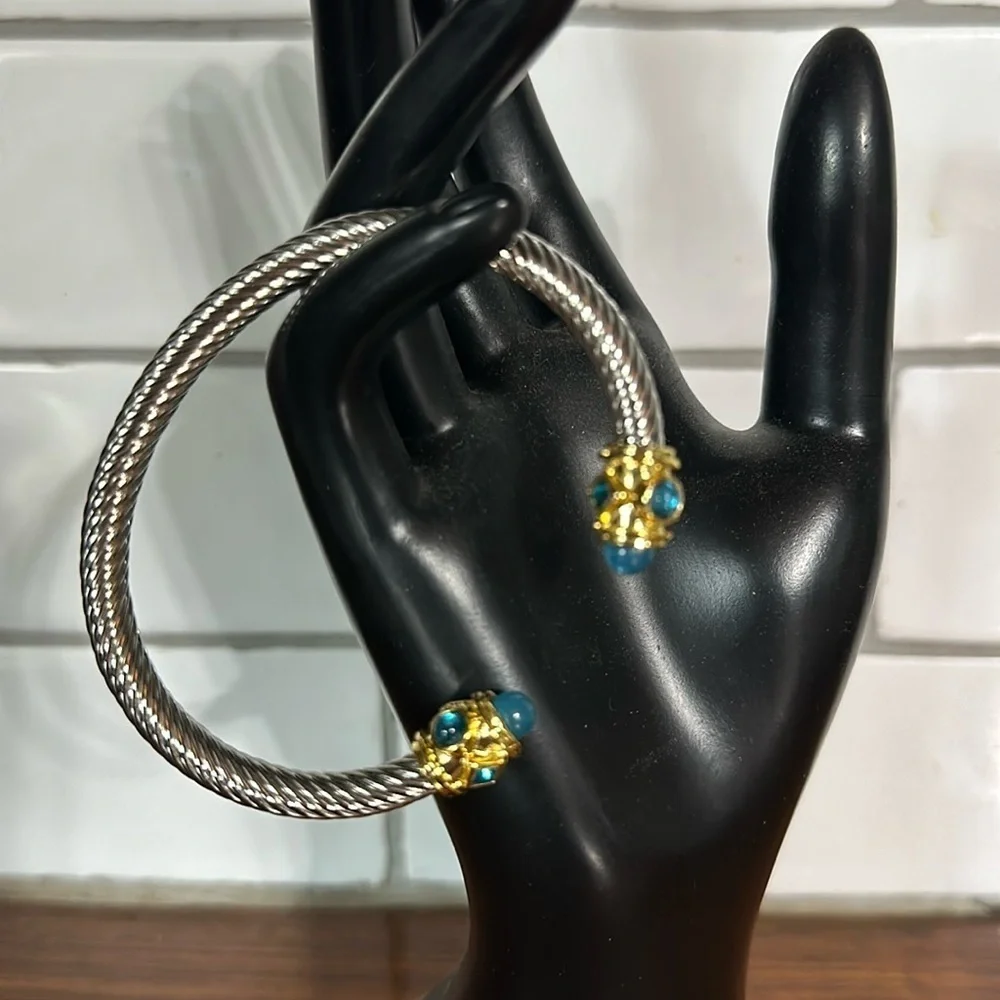 - Sophisticated Silver and Gold Bracelet with Blue Gemstones
